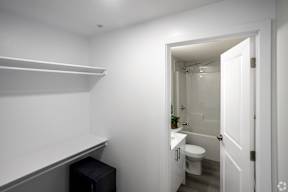 A white bathroom with a toilet and sink.at Hills on 36, Edmonton