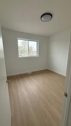 A room with a window and a door.