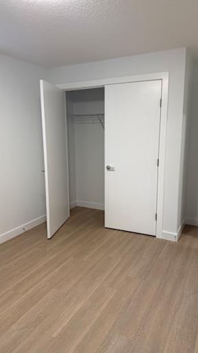 A white door is open to a hallway.
