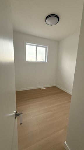 A room with a door and a window.
