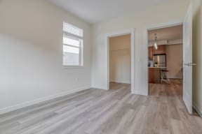 a bedroom with hardwood flooring at the oxford at estonia apartments in san an