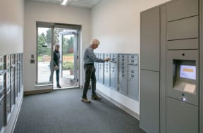 a man is looking at the lockers in a room