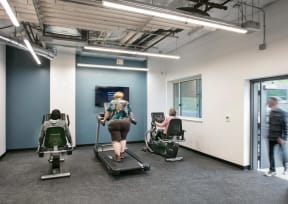 a group of people working out in a gym