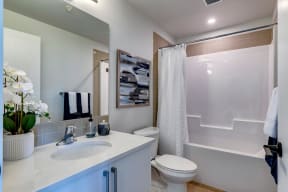 a bathroom with a toilet sink and bathtub at Shawnessy Station