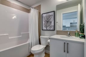 a bathroom with a toilet sink and bathtub