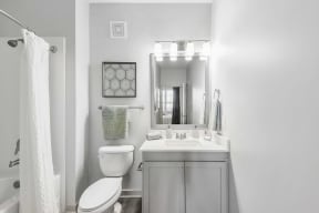 a bathroom with a sink toilet and bathtub