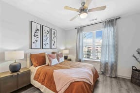 a bedroom with a bed and a ceiling fan south twenty cartersville ga