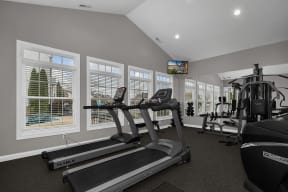 the gym at the enclave at woodbridge apartments in sugar land, tx