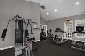 a gym with cardio equipment and exercise machines