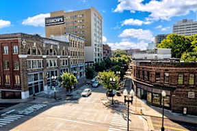 A city street with a Sterchi's building in the background.