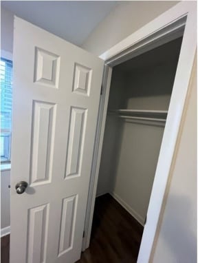 a room with a white door and a window