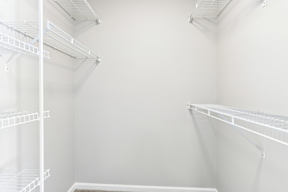 Empty white shelves in a room.
