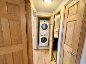 a small laundry room with a washing machine in it