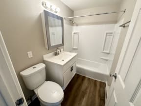 a bathroom with a toilet and a sink