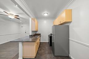 Kitchen in 6128 Wilshire apartment with plenty of cabinet storage, spacious countertops and appliances