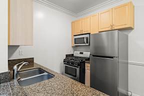 Kitchen in 6128 Wilshire apartment with plenty of cabinet storage, spacious countertops and updated appliances