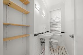 Bright and airy bathroom in 6128 Wilshire bathroom with tile flooring