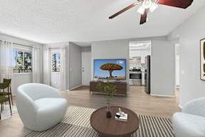 Oversized living area in Oro apartment home with wood-style plank flooring and a ceiling fan over dining nook.
