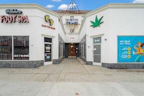 Front entrance of 6128 Wilshire with 4 commercial spaces and unique building style with historic LA charm