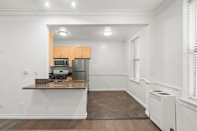 Dining nook and kitchen inside charming 6128 Wilshire Apartment