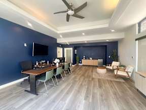 Leasing Office Interior at Oro with  coffee bar and seating area for prospects and residents to have an enjoyable and comfortable experience.