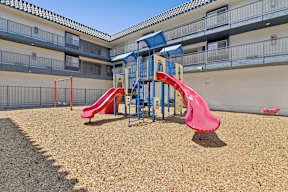 Play park at Oro with slides and play structure over mulch