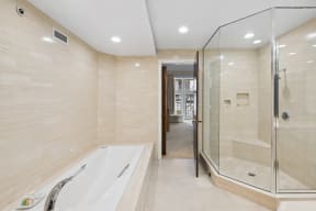 a large bathroom with a tub and a shower