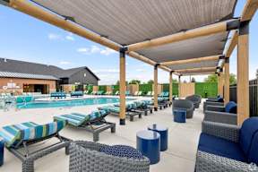 A large outdoor seating area with blue and grey cushioned furniture.