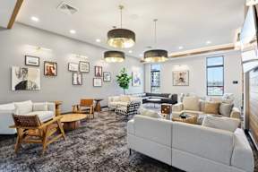 Spacious longue with comfortable sitting area located at Deforest Yards apartments in DeForest, WI