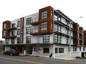 A multi-story building with the words "Brooklyn Yard" on the side.
