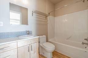 A white toilet sits in a bathroom.