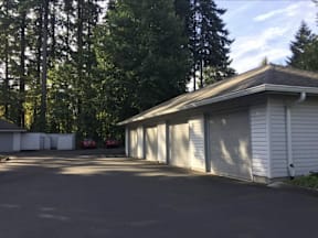 A white garage door is open and closed.