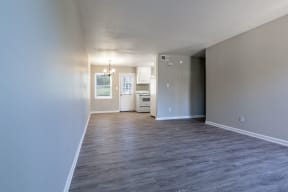 a living room and kitchen with a wood floor at Sharon West, North Carolina, 28210