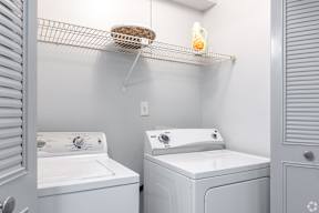 A laundry room with a washer and dryer.