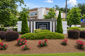 A sign in front of a building that says "Emerson 1600".