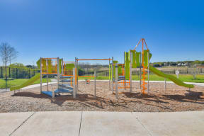 a newly renovated childrens playground at the heights at converse apartments in texas