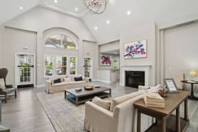 a living room with couches and a fireplace