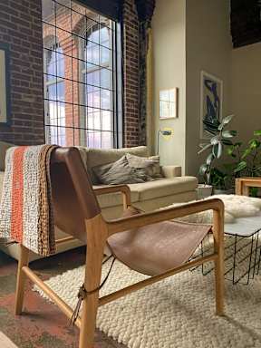 a living room with a couch and a chair