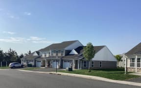 a large house with a street in front of it
