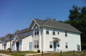 a large white house with a gray roof