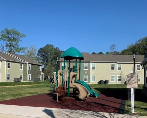 a playground at the whispering winds apartments in pearland, tx