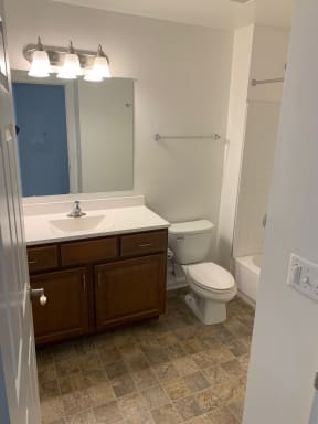 a view of the bathroom of a bedroom apartment at the historic electric building apartments in fort worth