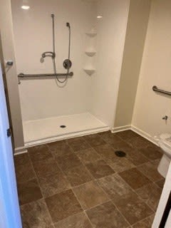 a bathroom with a shower and a toilet