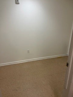 a room with a white wall and a white door