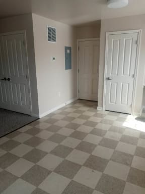 an empty room with a checkered floor