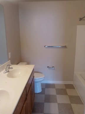 a bathroom with a toilet sink and bathtub