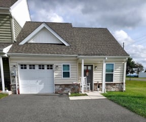 a white house with a white garage door