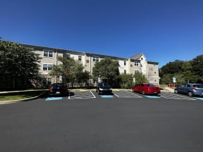 a parking lot in front of an apartment building