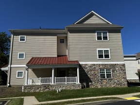 a house with a red metal roof