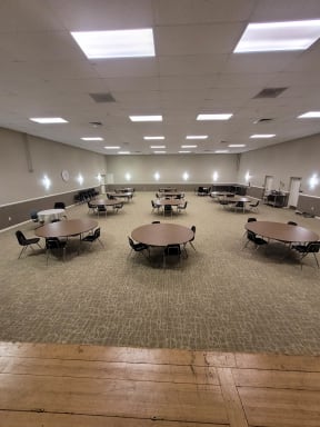 a large room with tables and chairs